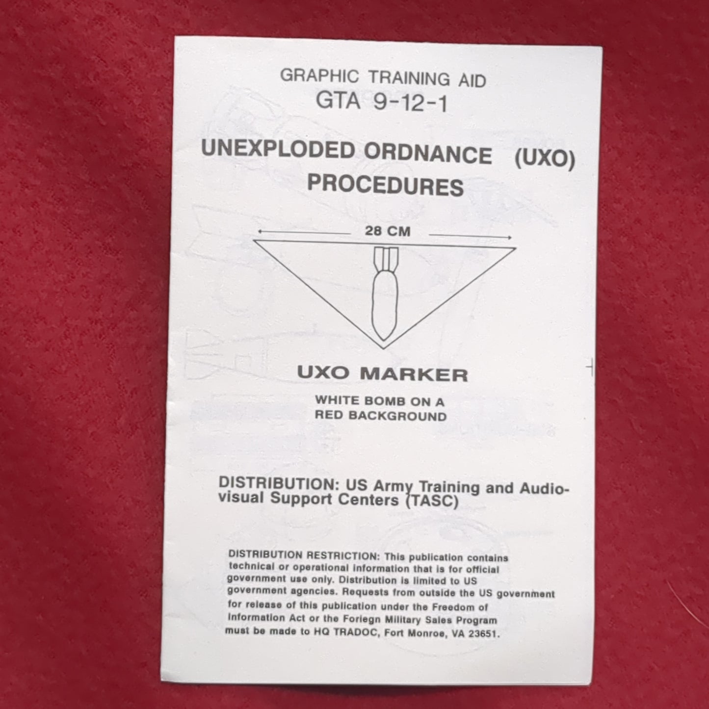 BOOK UNEXPLODED ORNANCE (UXO) PROCERDURES UXO MARKER WHITE BOMB ON A RED BACKGROUND (box10)