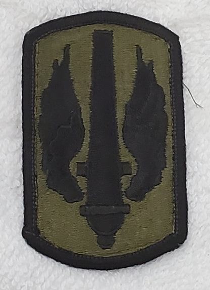 US Army 18th Field Artillery Brigade Subdued Sew On Patch OD BLACK (bu09-18fa)