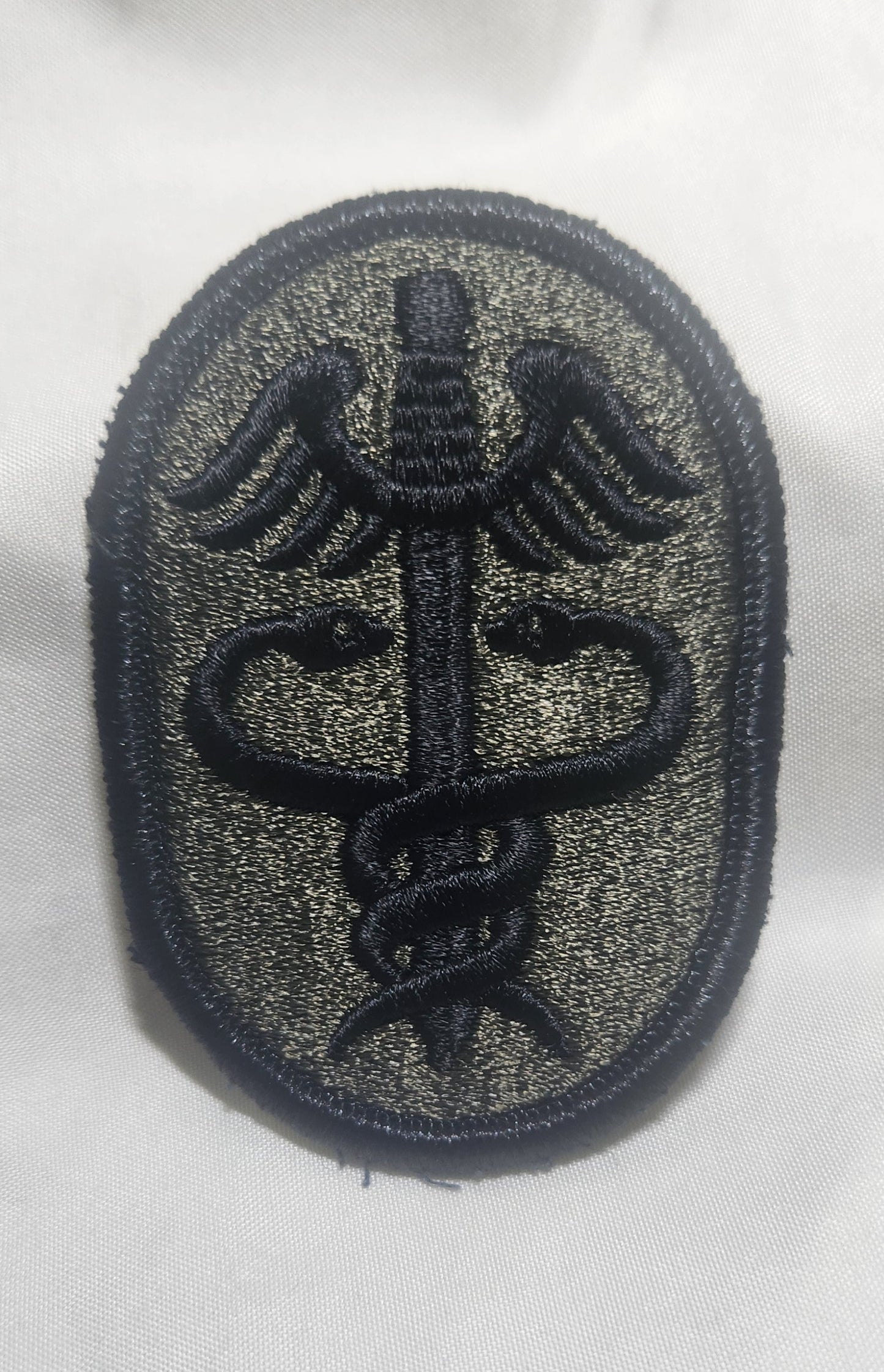 US Army Medical Health Services Command Patch Sew on Patch Subdued OD Black (WSA08-MHS)