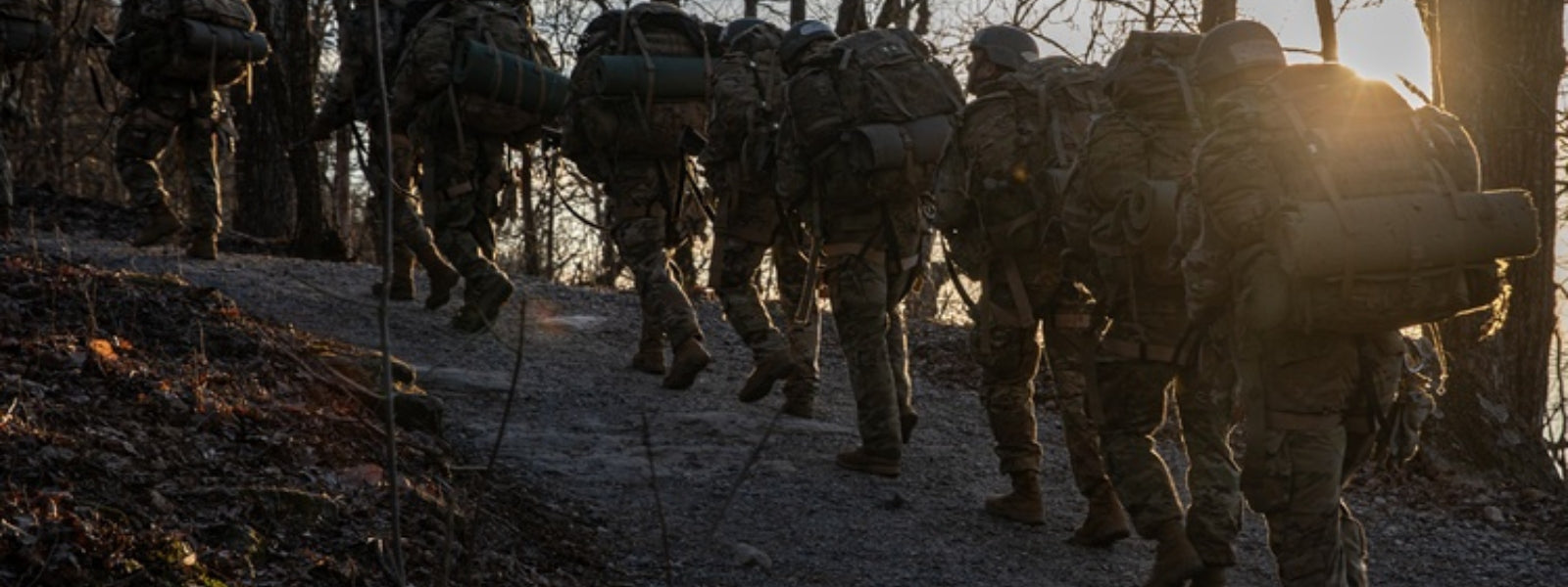 Group of Ranger Students with rucksacks on trail