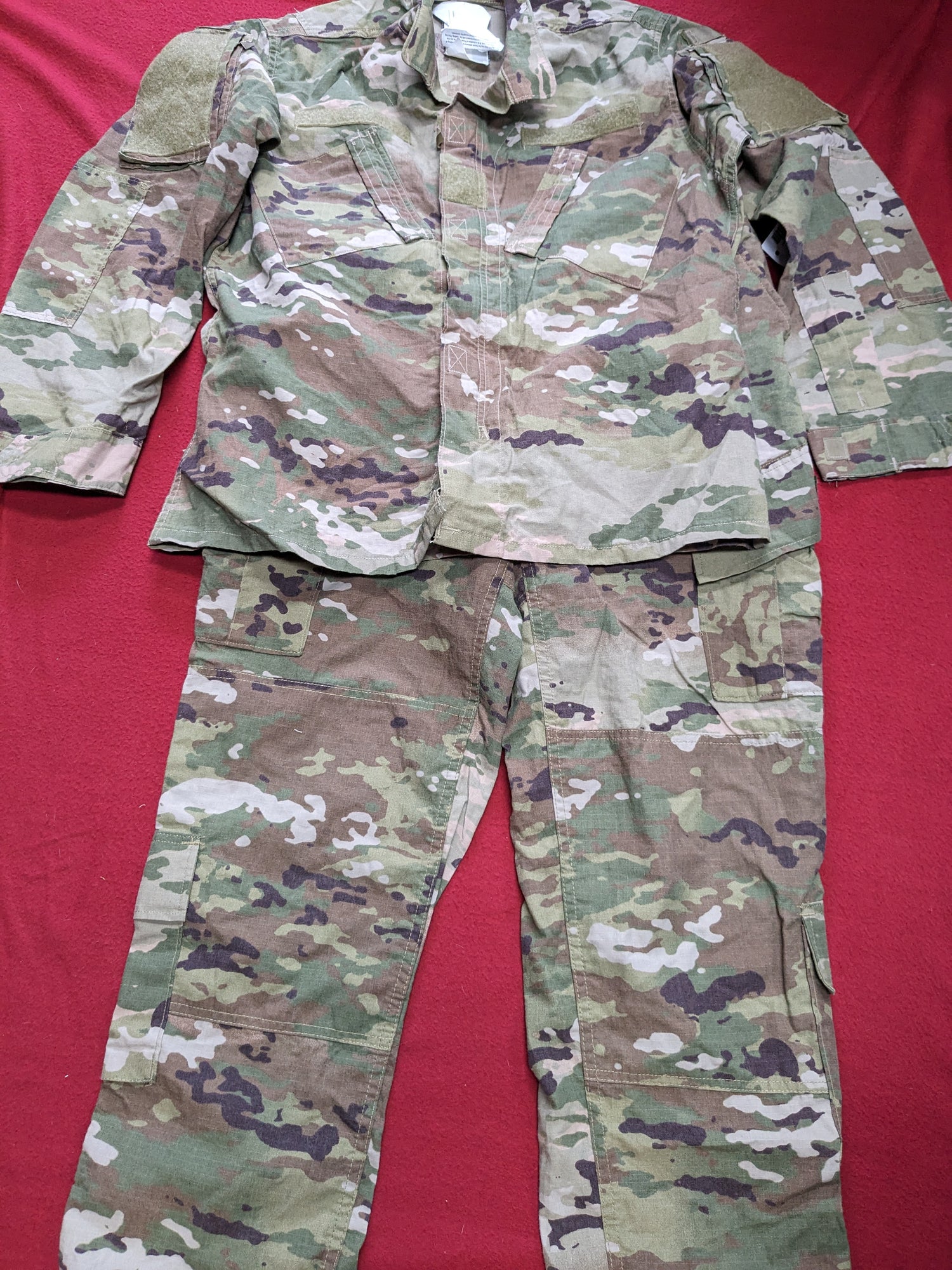 A set of medium regular deployment FRAC uniform top and pants in OCP Multicam camouflage pattern.