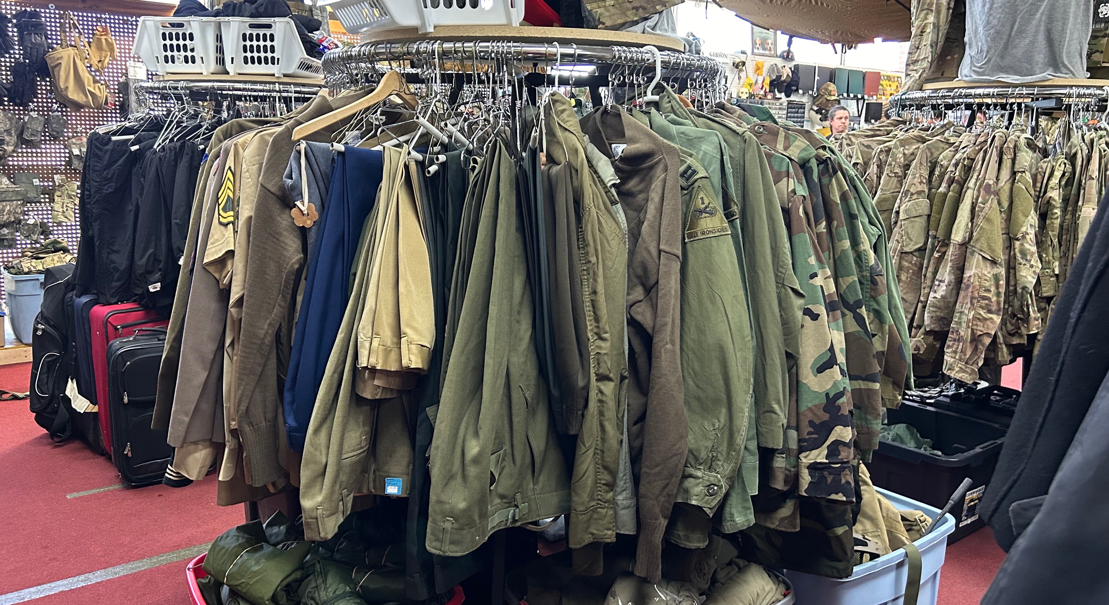 Military surplus uniforms on a store rack